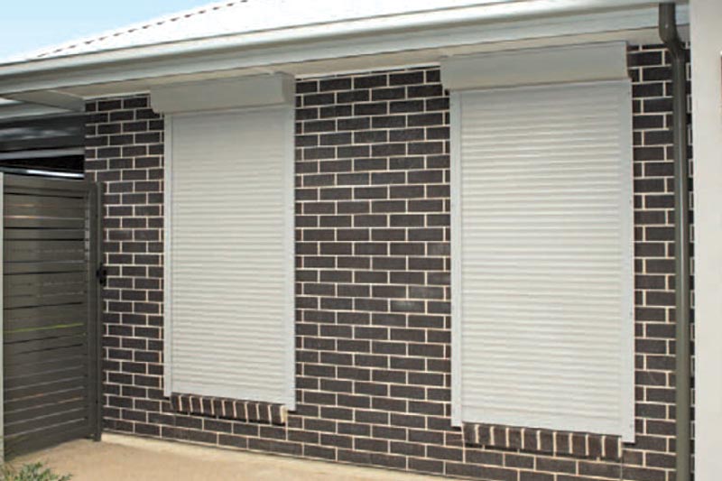 Modern building with closed roller shutters